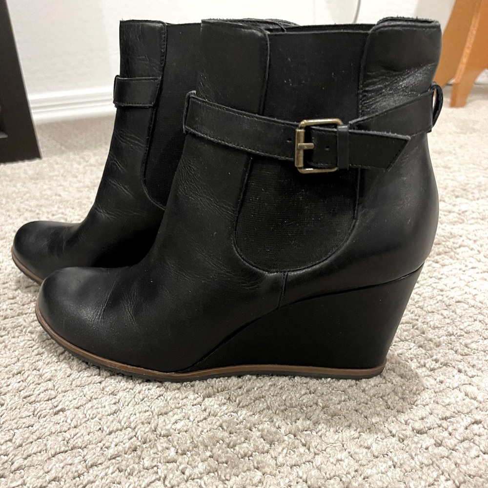 Black ankle booties w/ wedge heel. Never been worn